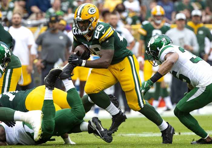 Green Bay Packers running back AJ Dillon (28) runs the ball against the New York Jets during a preseason game. Mandatory Credit: Samantha Madar/USA TODAY NETWORK-Wisconsin via USA TODAY NETWORK